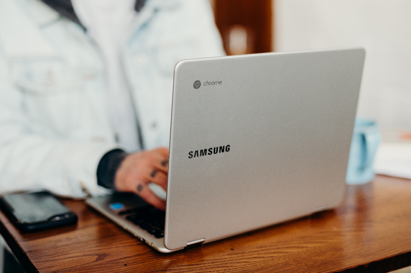 a person working on a Samsung Chromebook